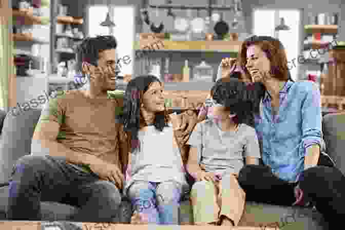 A Happy Family Of Four Sitting On The Couch In Their Living Room. Raising Grateful Kids In An Entitled World: How One Family Learned That Saying No Can Lead To Life S Biggest Yes